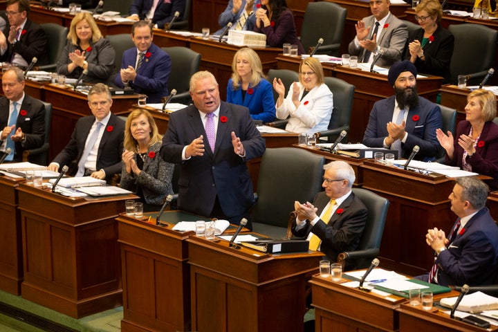 Ontario Premier Doug Ford receives applause from seated PC MPPs as he speaks in the Ontario legislature in Toronto, on Oct. 28, 2019.