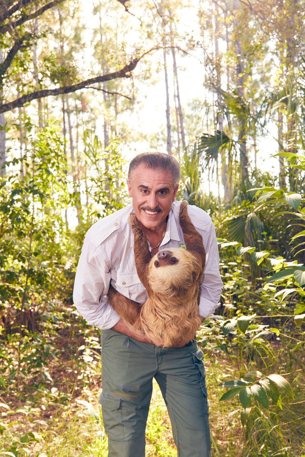 Magill with Chelsea, a Hoffmann's two-toed sloth.