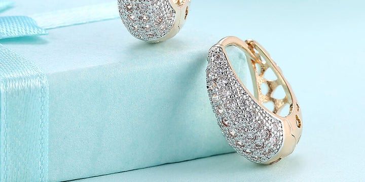 A bit bolder than the popular Meghan Markle-style huggies, these huggie earrings will add a major dose of sparkle to your outfits.