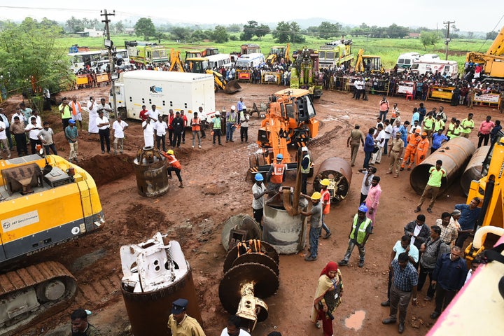 Rescue workers gather with heavy digging equipment during the operation to rescue Sujith Wilson near Manapparai town in Tiruchirappalli district, on October 28, 2019. 