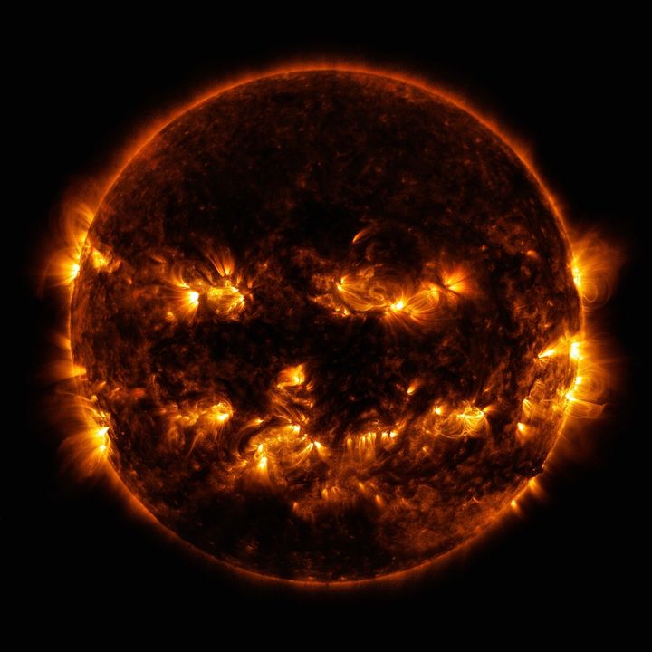 In this Oct. 8, 2014 photo released by NASA, active regions on the sun combine to look something like a jack-o-lantern’s face. The image was captured by NASA's Solar Dynamics Observatory, or SDO, which watches the sun at all times from its orbit in space. (NASA via AP)