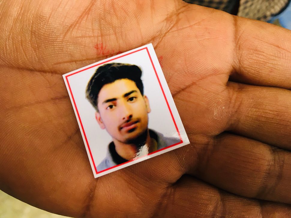 Passport-size photograph of Osaib Altaf. 