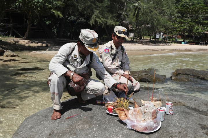 Cambodia soldiers offer prayers in hopes of finding Bambridge on Koh Rong island 