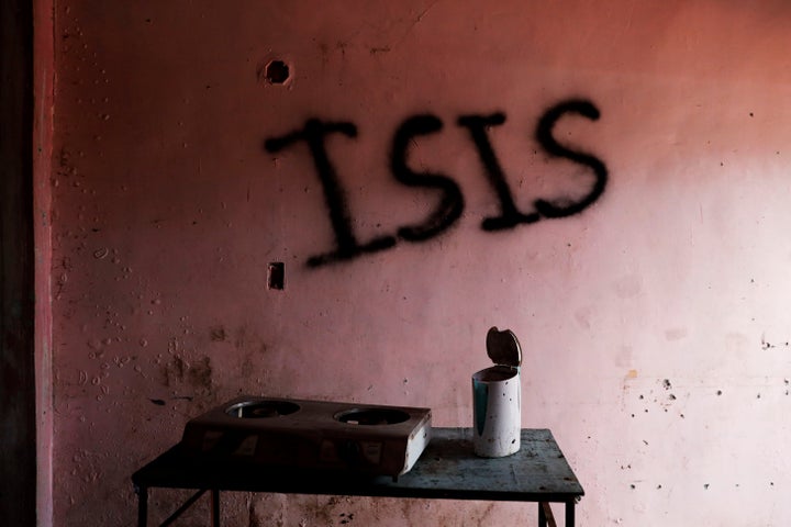 Pro-Islamic State groups operate outside of Syria and Iraq. Here, the word "ISIS" is seen spray-painted in a home in Marawi City, Philippines, in May 2019, two years after militants began their attacks there.