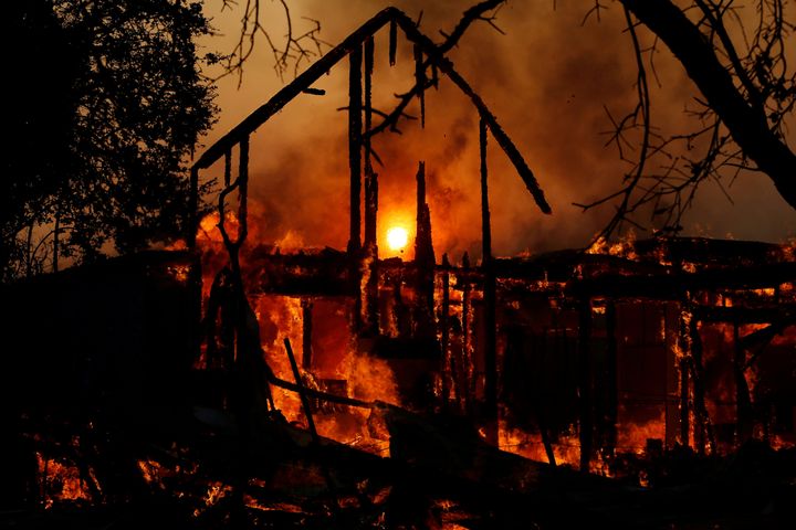 A structure burns in the wind-driven Kincade fire in Healdsburg, California, on Sunday.
