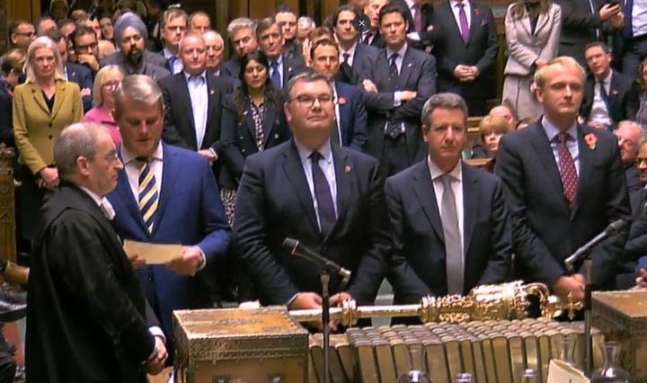 MPs reads out the result of the vote as legislation for an early general election on December 12. It cleared the House of Commons after MPs voted in favour by 438 to 20, a majority of 418.