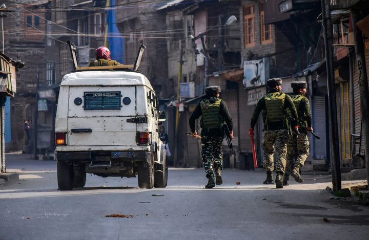 Paramilitary troopers patrol a street during clashes on October 29, 2019.