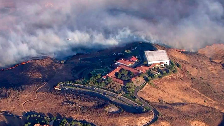 The Ronald Reagan Presidential Library as flames from the Easy fire approach in Simi Valley, Calif., Wednesday, Oct. 30, 2019.