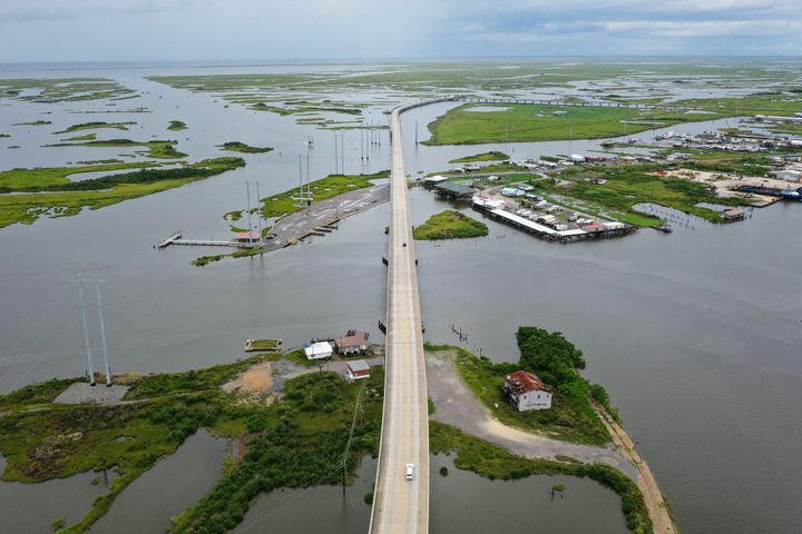The Louisiana Highway 1 Bridge rises above the marshland and coastal waters of Leeville, Louisiana, in August. The state erected the 19-mile elevated roadway in 2009 after flooding become a constant issue during storms and high tides.