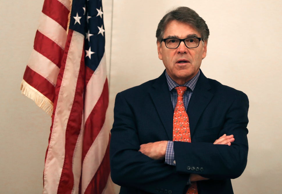 The outgoing Energy Secretary Rick Perry talks to journalists in Dubai, United Arab Emirates, on Oct. 26.