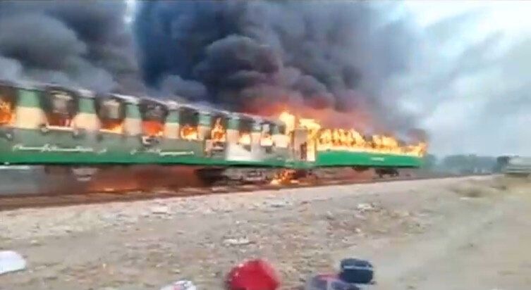 Flames roared through the train cars as the train approached the town of Liaquatpur in Punjab