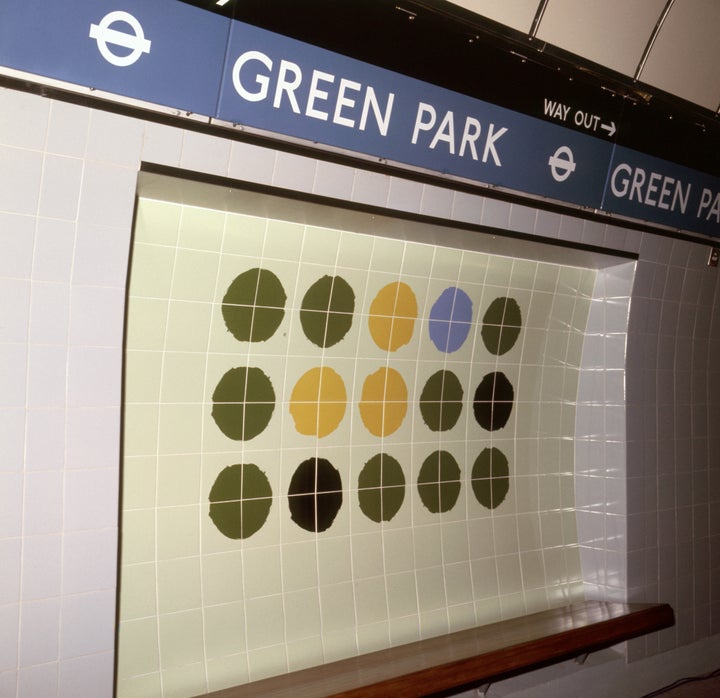 Mosaic tiles on the walls of Green Park underground station, London.