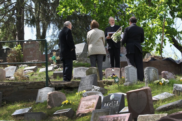 Pet chaplain David James conducts a graveside service for Justin, a 12-year-old beagle-hound, at the Hartsdale Pet Cemetery in April 2012. Attorney Spencer Warren brought Justin from Annandale, Virginia to be buried. 