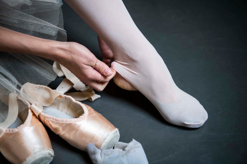 Teuscher adjusts her stirrup tights.