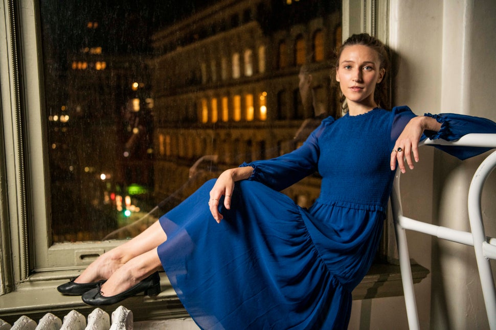 Teuscher poses in her evening wear, a blue dress from <a href="https://www.aritzia.com/us/en/clothing/dresses" target="_blank" rel="noopener noreferrer">Aritzia</a> with <a href="https://www.repetto.com/us/women/women-shoes/ballerinas.html" target="_blank" rel="noopener noreferrer">Repetto</a> black ballet flats.