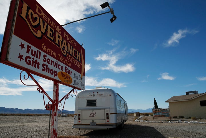 In this Oct. 16, 2018, file photo, a sign advertises the Love Ranch brothel in Pahrump, Nev. A federal judge in Nevada has dismissed a lawsuit that invoked sex trafficking laws in a bid to close the nation's only legal brothels. 