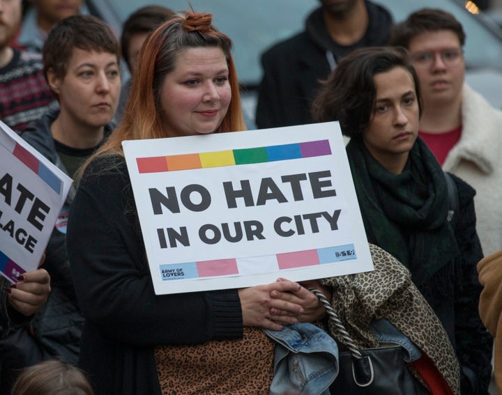 Hundreds protest an event featuring Meghan Murphy at the Palmerston library branch.