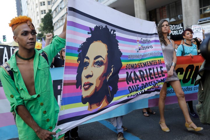 Protesters carry the image of slain councilwoman Marielle Franco in Rio de Janeiro on Sept. 7, 2019. 