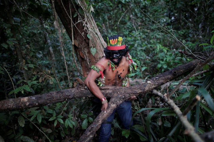 FILE: A Guajajara Indian "forest guardian" lifts a tree trunk at a makeshift camp on Arariboia indigenous land near the city of Amarante, Maranhao state, Brazil, September 10, 2019. REUTERS/Ueslei Marcelino