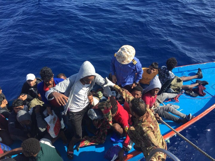 Migrants are seen in a dinghy as they are rescued by Libyan coast guards in the Mediterranean Sea off the coast of Libya, October 18, 2019. 