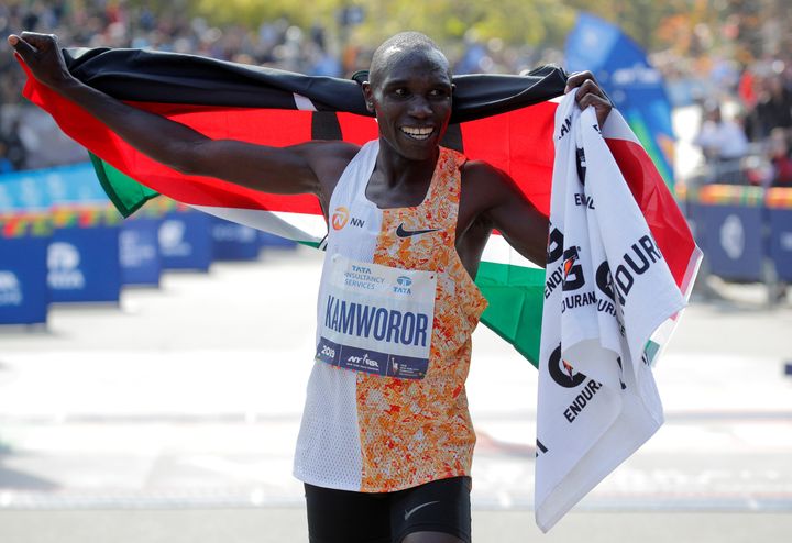 Kenya's Geoffrey Kamworor celebrates winning the elite men's race on Sunday.