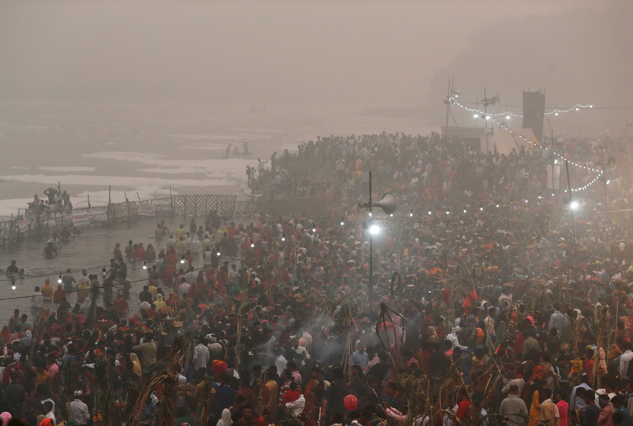 <strong>Hindu devotees worship the Sun god in the polluted waters of the river Yamuna during the Hindu religious festival of Chatth Puja</strong>