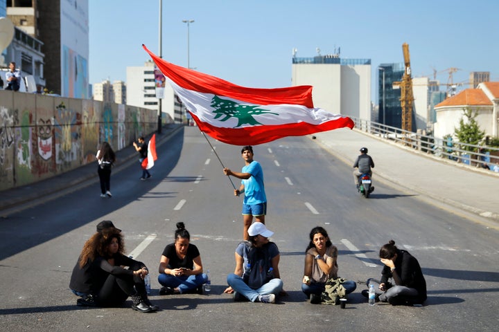 Anti-government protesters block a main highway in Beirut, Lebanon, Monday, Nov. 4, 2019. 