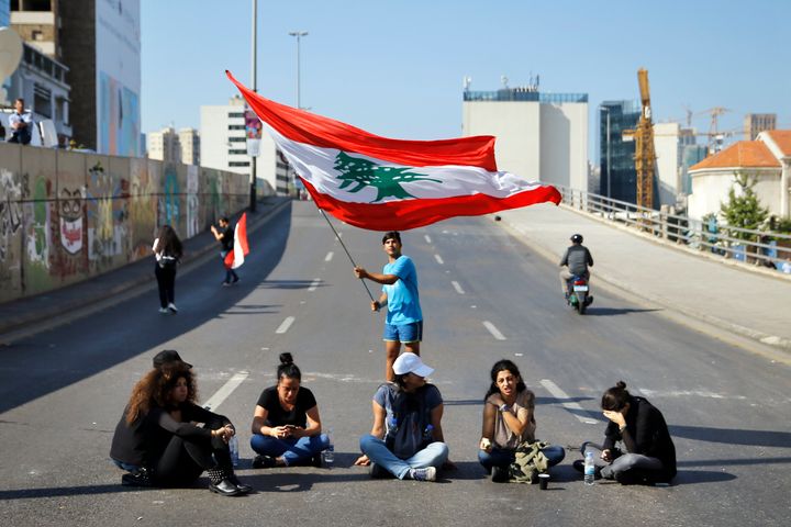 Anti-government protesters block a main highway in Beirut, Lebanon, Monday, Nov. 4, 2019.&nbsp;