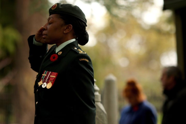 Lieutenant Kerry-Ann Cameron salutes during Remembrance Day ceremony at God's Acre Veteran's Cemetery in Victoria, B.C., on Nov. 11, 2018.