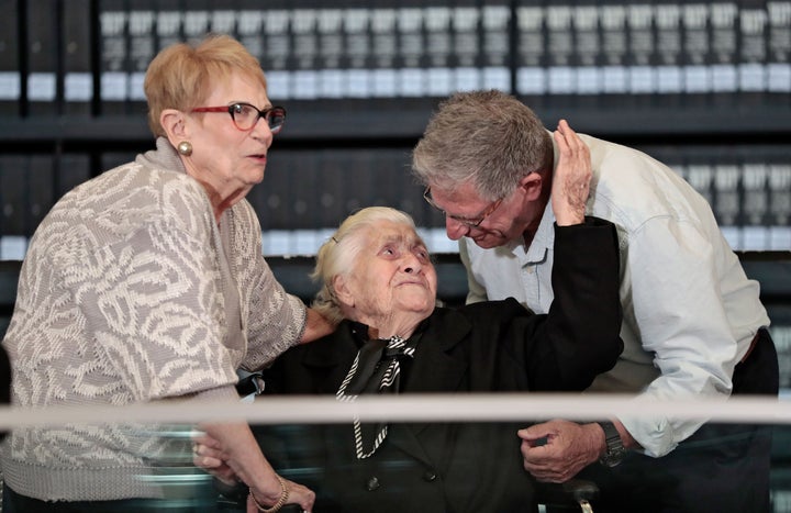 Melpomeni Dina, center, is reunited with Holocaust survivors Yossi Mor, right, and his sister Sarah Yanai at the Yad Vashem Holocaust memorial in Jerusalem on Nov. 3, 2019.