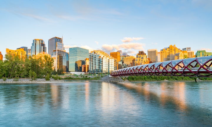 Skyline of the city Calgary, Alberta, Canada along the Bow River with Peace Bridge