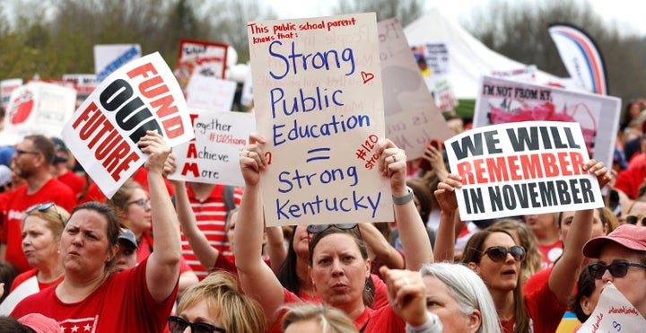 Kentucky Public school teachers rally for a "day of action" at the Kentucky State Capitol to try to pressure legislators to override Gov. Matt Bevin's (R) recent veto of the state's tax and budget bills, April 13, 2018, in Frankfort, Kentucky.