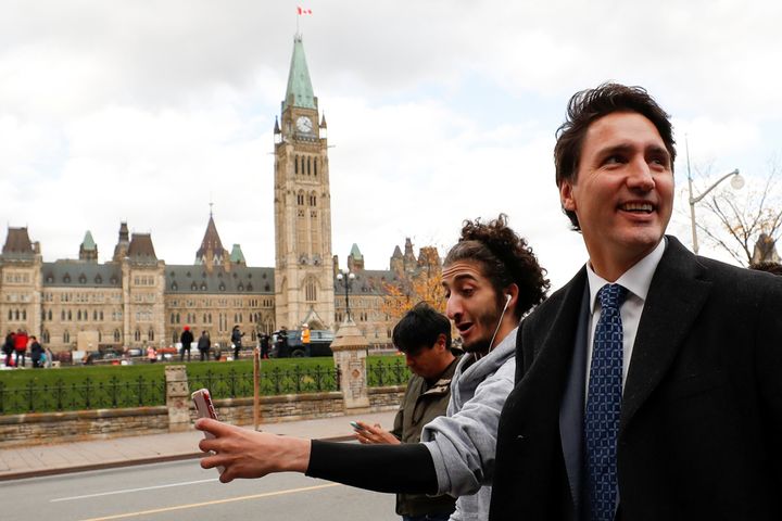 Prime Minister Justin Trudeau walks in front of the Peace Tower in Ottawa on Oct. 23, 2019 before speaking to the news media for the first time since winning a minority government.