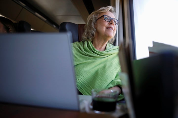 Green Party Leader Elizabeth May looks at the scenery while travelling by train for an election campaign visit in Montreal on Oct. 8, 2019. 