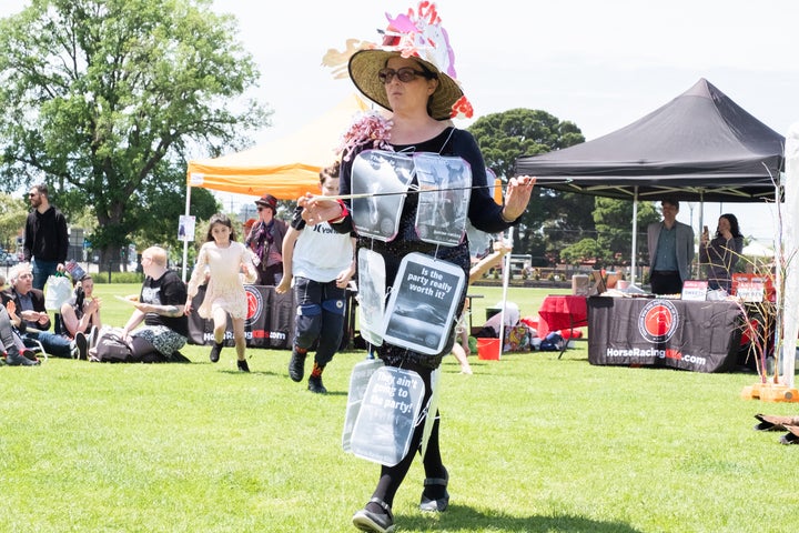 A protester wearing placards over her dress to take a stand. 