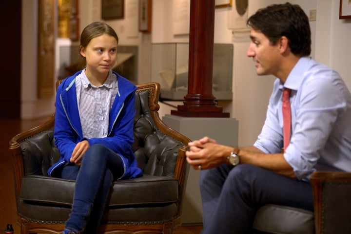 Justin Trudeau greets Swedish climate change teen activist Greta Thunberg before a march in Montreal on Sept. 27, 2019.
