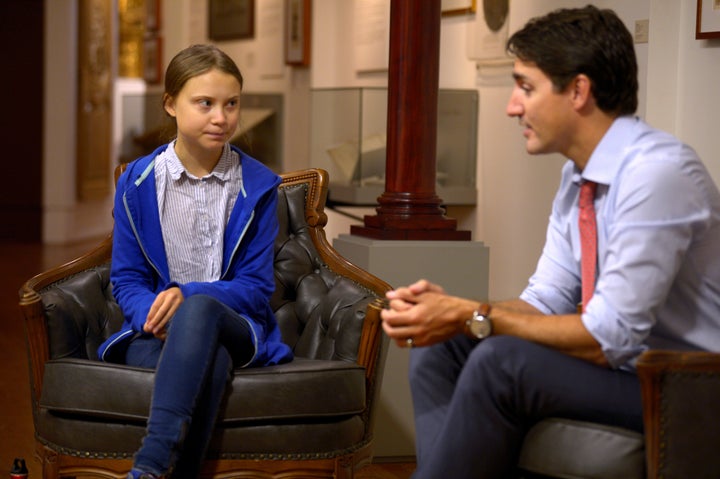 Justin Trudeau greets Swedish climate change teen activist Greta Thunberg before a march in Montreal on Sept. 27, 2019. 