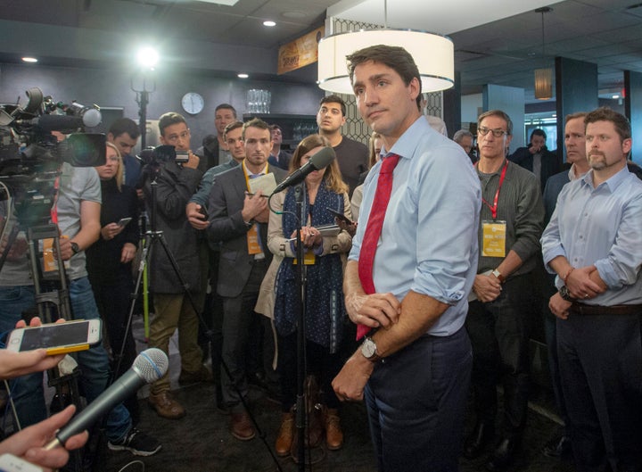 Liberal Leader Justin Trudeau speaks to reporters while campaigning on Oct. 4, 2019 in Quebec City.