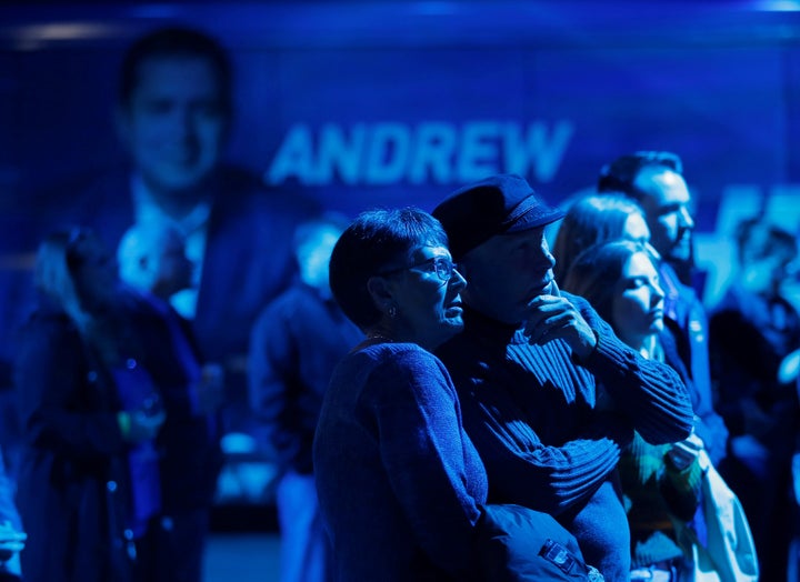 Conservative supporters watch the election results come in at Andrew Scheer's campaign headquarters in Regina on Oct. 21, 2019.