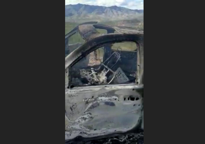 The burnt wreckage of a vehicle transporting a Mormon family living near the border with the U.S. is seen, after the family w