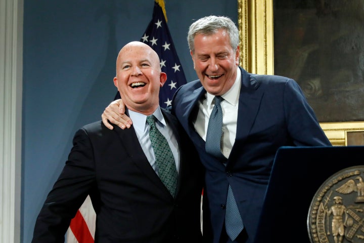 New York City Police Commissioner James O'Neill, left, is embraced by New York Mayor Bill de Blasio at New York's City Hall,