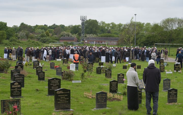 People at the grave of Evha Jannath after her funeral at Saffron Hill Cemetery in Leicester in 2017 