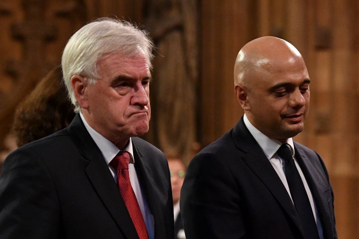 Chancellor of the Exchequer Sajid Javid (right) and Shadow chancellor John McDonnell in the Central Lobby as they walk back to the House of Commons after the Queen's Speech during the State Opening of Parliament ceremony in London.
