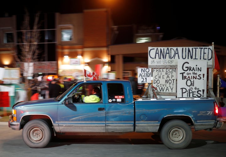 Protesters gather outside a campaign rally for Liberal Leader Justin Trudeau in Calgary on Oct. 19, 2019.