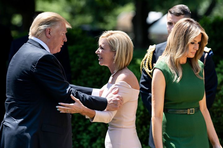 President Donald Trump talks to Pastor Paula White after an event to celebrate a national day of prayer at the White House on May 2, 2019.