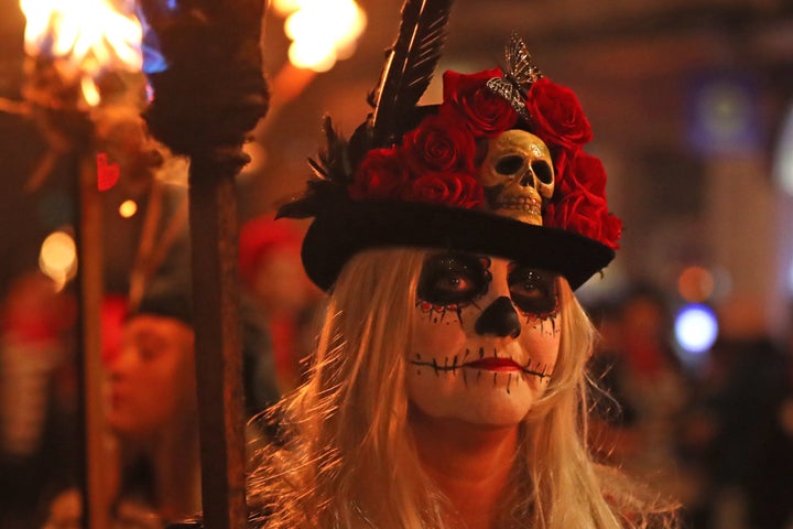 Participants parade through the town of Lewes in East Sussex during an annual bonfire night procession held by the Lewes Bonfire Societies.