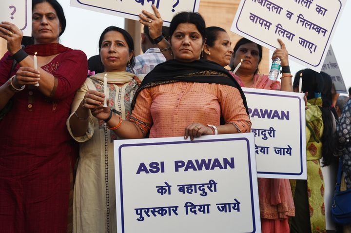 Families of Delhi Police personnel protest against attacks on the cops by lawyers, at India Gate on November 5, 2019 in New Delhi.