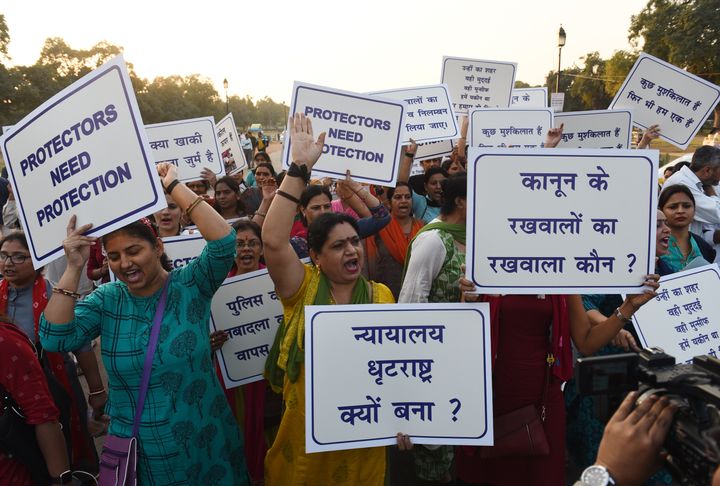 Families of Delhi Police personnel protest against attacks on the cops by lawyers, at India Gate on November 5, 2019 in New Delhi.