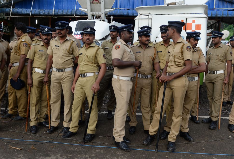 Kerala policement stand guard in Nilackal.