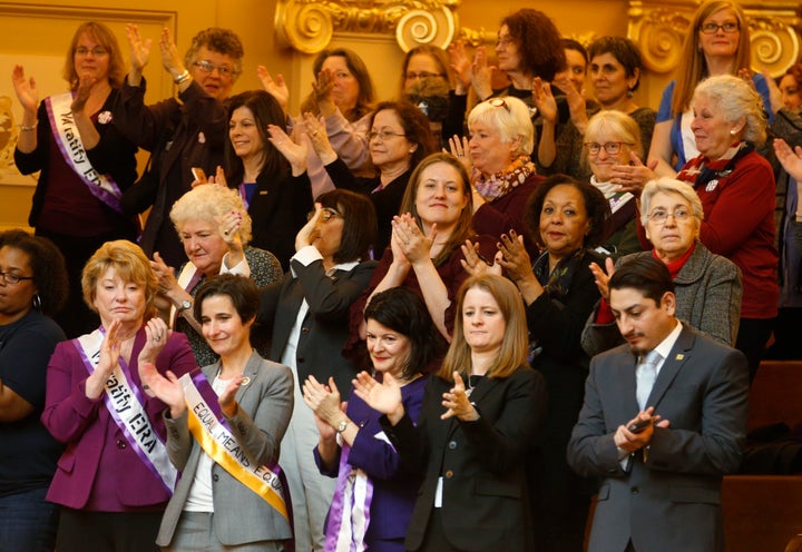 Democratic state senators applaud a speech along with other ERA supporters in the gallery of the the House of Delegates in Richmond, Virginia, on February 21, 2019.